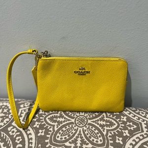 Used authentic yellow Coach wristlet